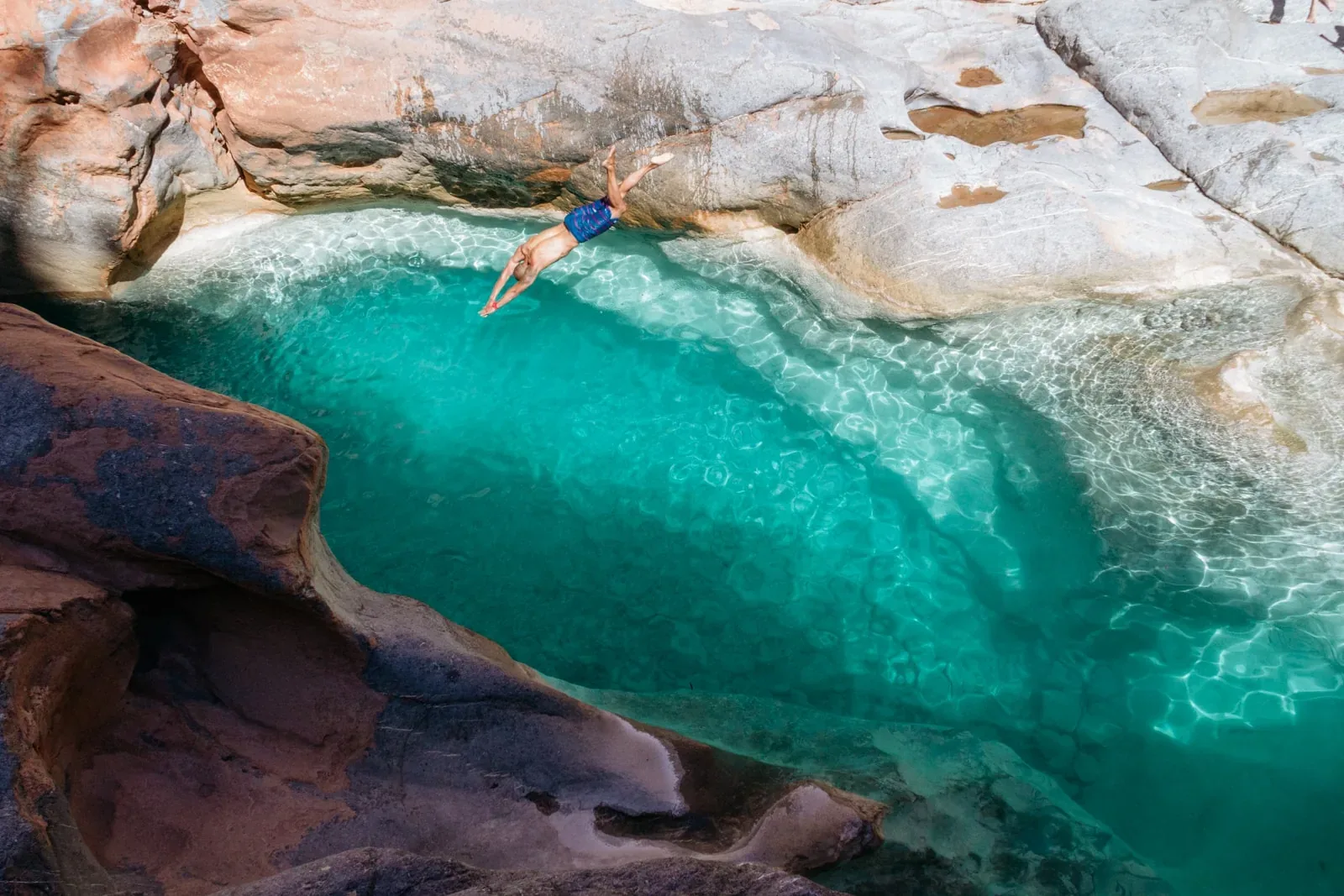 Natural rock pools in a palm-lined valley near Agadir